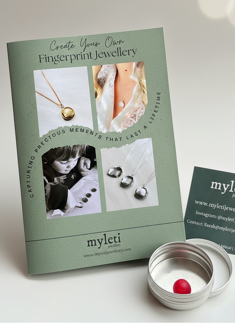 Myleti fingerprint jewellery kit with instructions and a small container on a wooden surface.